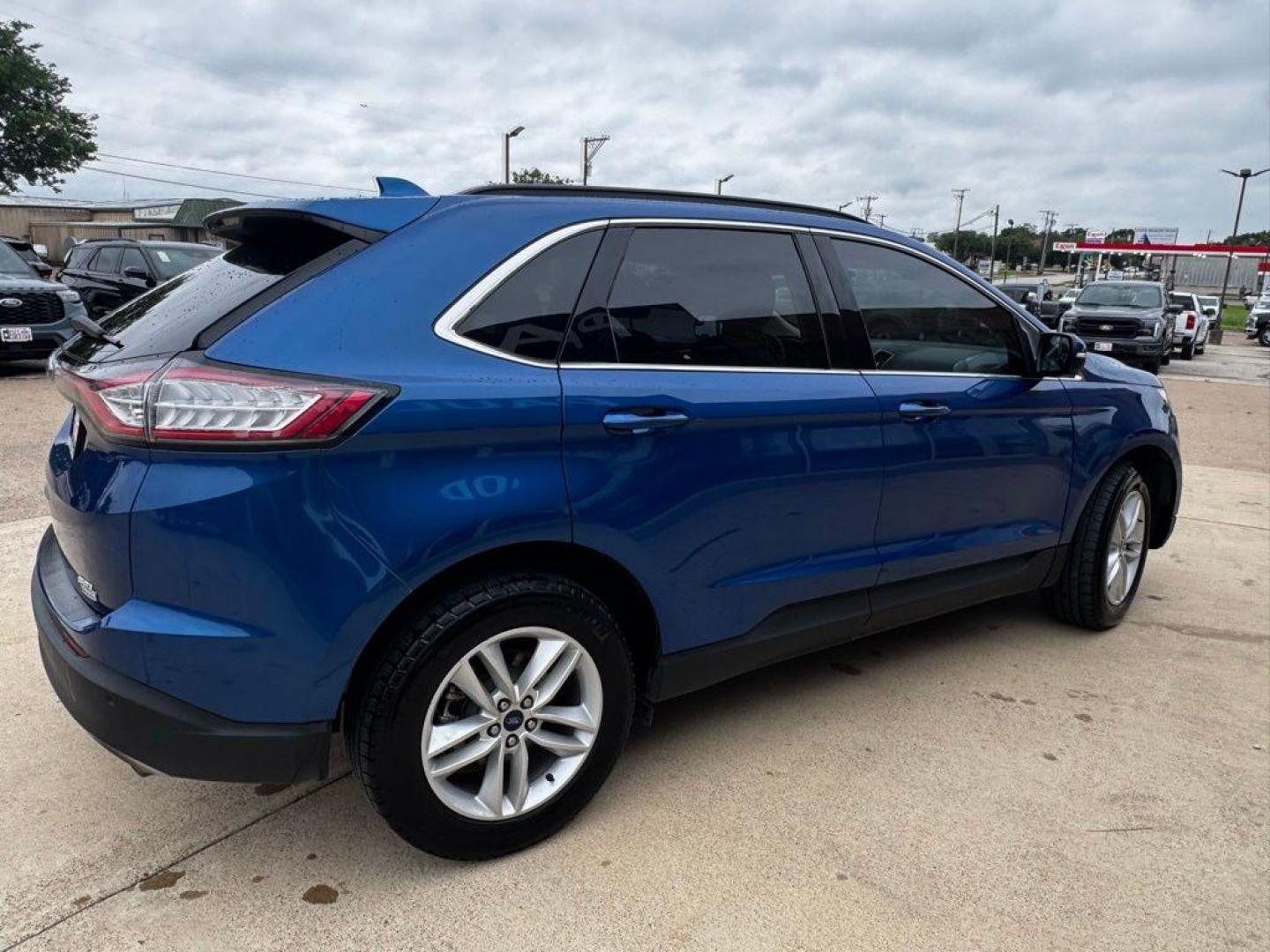 2018 Lightning Blue /Dune Ford Edge SEL (2FMPK3J90JB) with an EcoBoost 2.0L I4 GTDi DOHC Turbocharged VCT engine, Automatic transmission, located at 1105 E Mulberry, Kaufman, TX, 75142, (972) 962-2151, 32.589550, -96.300926 - Lightning Blue 2018 Ford Edge 4D Sport Utility SEL FWD 6-Speed Automatic EcoBoost 2.0L I4 GTDi DOHC Turbocharged VCT<br><br><br>Recent Arrival! 20/29 City/Highway MPG<br><br>Awards:<br> * 2018 KBB.com Brand Image Awards * 2018 KBB.com 10 Most Awarded Brands<br>Please call Paul Murrey Ford Inc. In - Photo#2