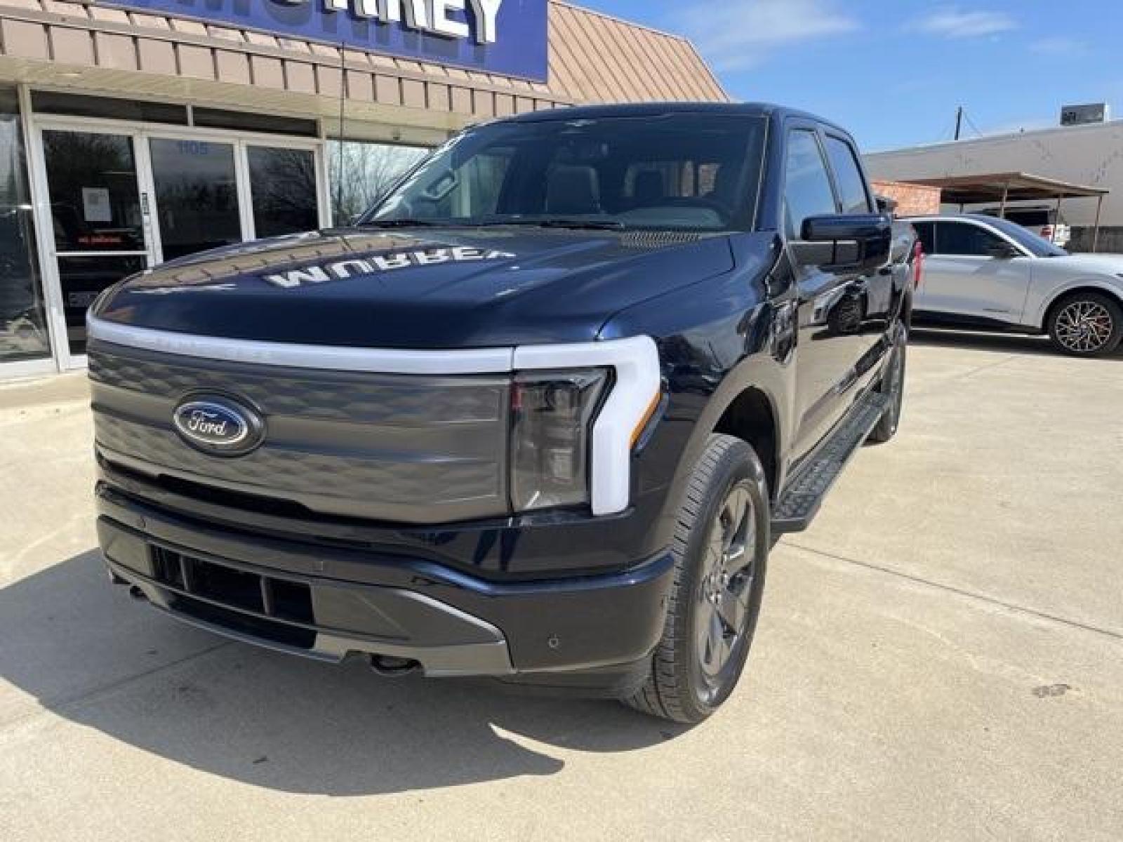 2023 Antimatter Blue Metallic /Black Ford F-150 Lightning Lariat (1FT6W1EVXPW) with an Electric ZEV 426hp engine, Automatic transmission, located at 1105 E Mulberry, Kaufman, TX, 75142, (972) 962-2151, 32.589550, -96.300926 - Antimatter Blue Metallic 2023 Ford F-150 Lightning 4D Crew Cab Lariat AWD Single-Speed Automatic Electric ZEV 426hp<br><br>78/63 City/Highway MPG<br><br><br>Please call Paul Murrey Ford Inc. In Kaufman Texas A Family Dealership Since 1952 Serving the Dallas Fort Worth and East Texas areas for over 7 - Photo #1