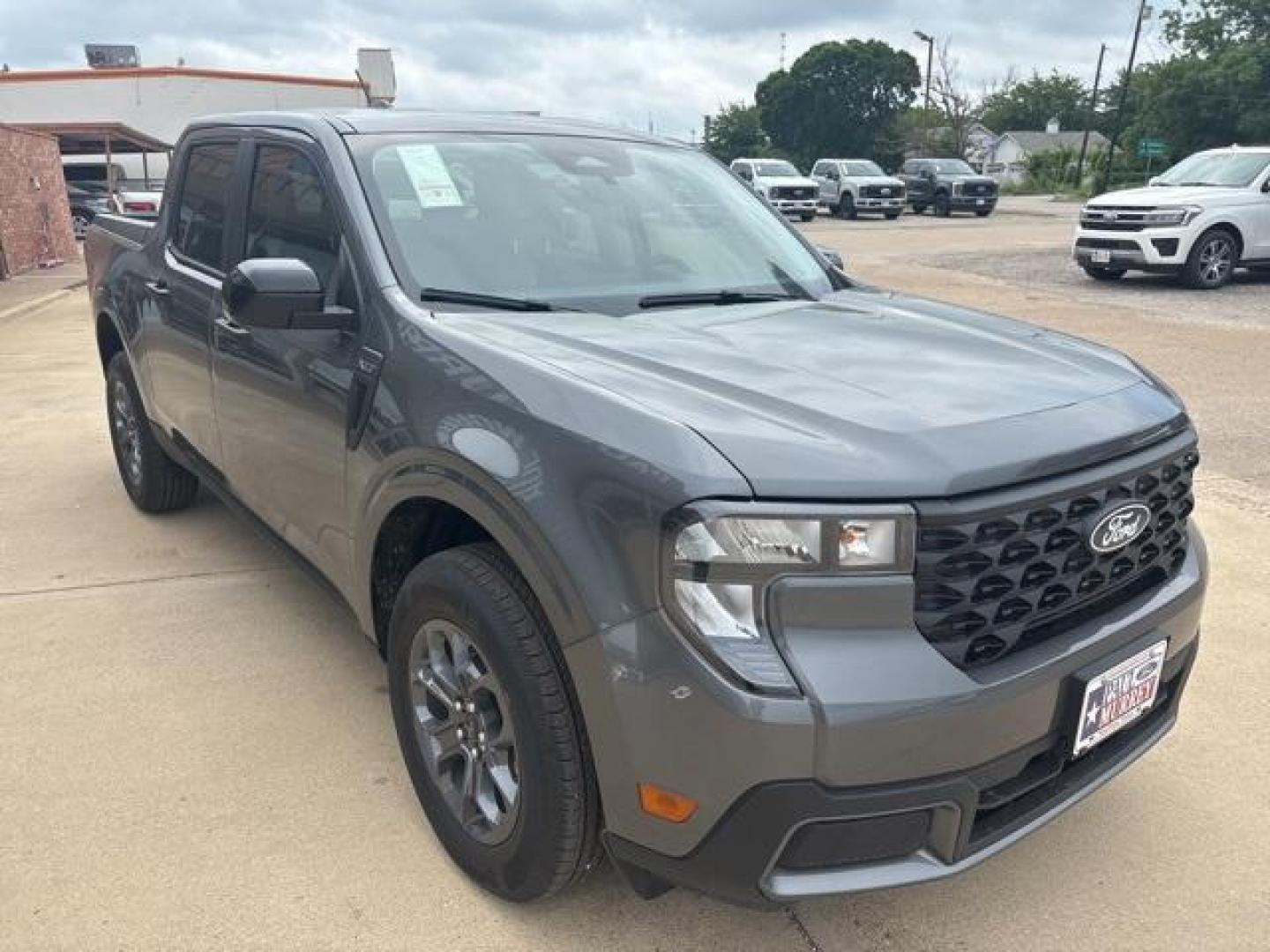 2025 Carbonized Gray Metallic /Blue Ford Maverick XLT (3FTTW8H37SR) with an 2.5L I-4 Hybrid engine, CVT transmission, located at 1105 E Mulberry, Kaufman, TX, 75142, (972) 962-2151, 32.589550, -96.300926 - Carbonized Gray Metallic 2025 Ford Maverick 4D Crew Cab XLT FWD CVT 2.5L I-4 Hybrid 2.5L I-4 Hybrid.<br><br>42/35 City/Highway MPG<br><br><br>Please call Paul Murrey Ford Inc. In Kaufman Texas A Family Dealership Since 1952 Serving the Dallas Fort Worth and East Texas areas for over 70 years. Please - Photo#6
