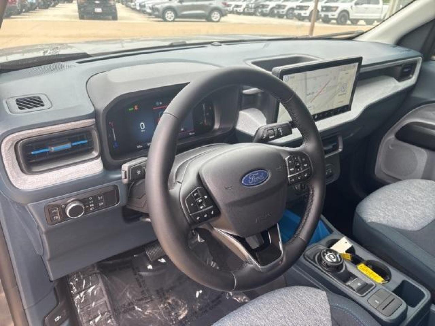 2025 Carbonized Gray Metallic /Blue Ford Maverick XLT (3FTTW8H37SR) with an 2.5L I-4 Hybrid engine, CVT transmission, located at 1105 E Mulberry, Kaufman, TX, 75142, (972) 962-2151, 32.589550, -96.300926 - Carbonized Gray Metallic 2025 Ford Maverick 4D Crew Cab XLT FWD CVT 2.5L I-4 Hybrid 2.5L I-4 Hybrid.<br><br>42/35 City/Highway MPG<br><br><br>Please call Paul Murrey Ford Inc. In Kaufman Texas A Family Dealership Since 1952 Serving the Dallas Fort Worth and East Texas areas for over 70 years. Please - Photo#12