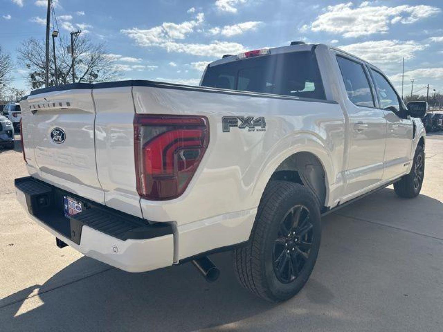 2026 Star White Metallic Tri-Coat /Black Ford F-150 Platinum (1FTFW7LD2TF) with an 3.5L PowerBoost Full-Hybrid V6 engine, Automatic transmission, located at 1105 E Mulberry, Kaufman, TX, 75142, (972) 962-2151, 32.589550, -96.300926 - 3.5L PowerBoost Full-Hybrid V6, 4WD.<br>Star White Metallic Tri-Coat 2026 Ford F-150 4D SuperCrew Platinum 4WD 10-Speed Automatic 3.5L PowerBoost Full-Hybrid V6 23/23 City/Highway MPG - Photo#4