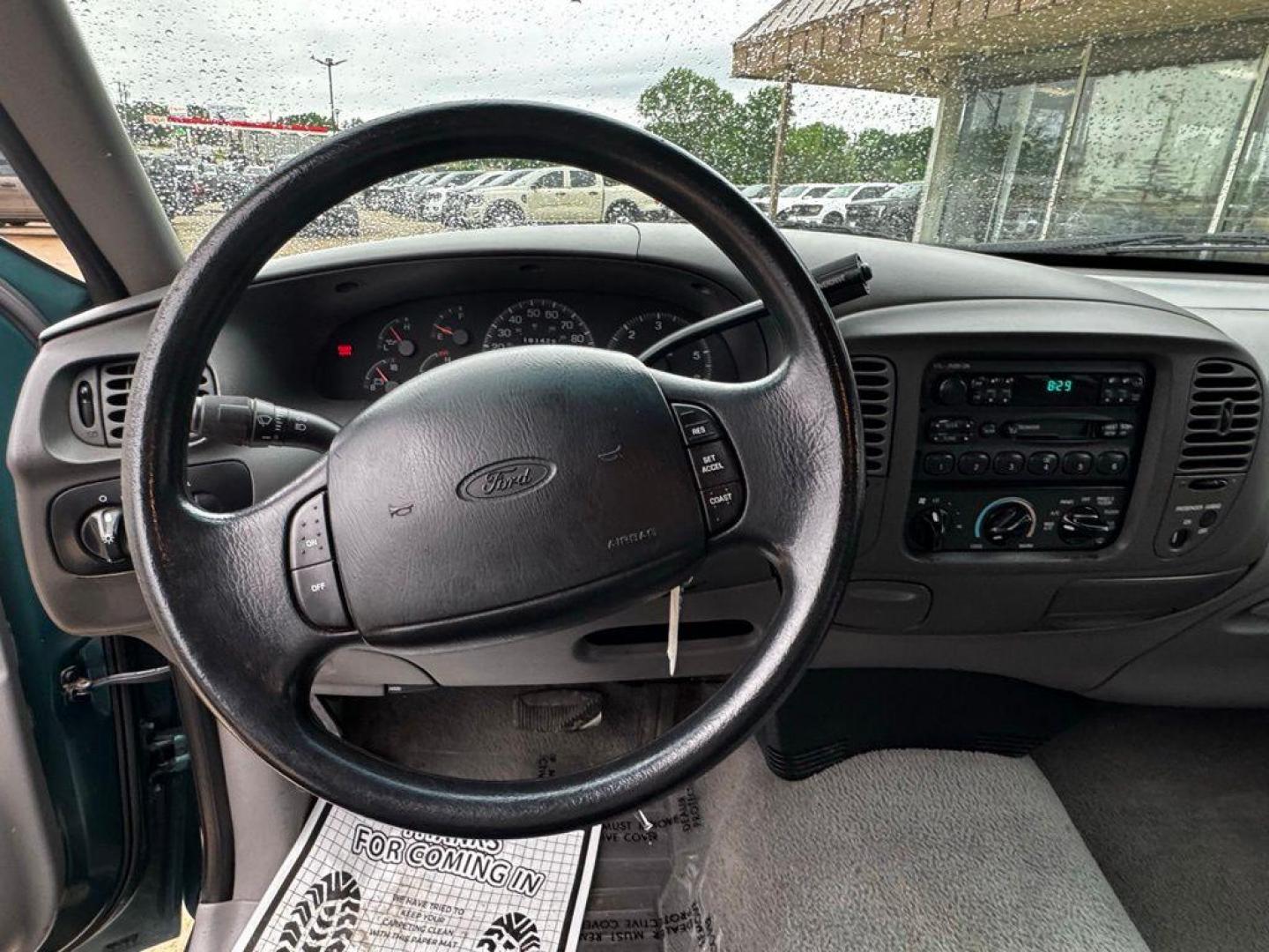 1998 Pacific Green Clearcoat Metallic Ford F-150 (1FTZX1727WK) with an 4.2L V6 EFI engine, Automatic transmission, located at 1105 E Mulberry, Kaufman, TX, 75142, (972) 962-2151, 32.589550, -96.300926 - Green 1998 Ford F-150 RWD 4-Speed Automatic with Overdrive 4.2L V6 EFI<br><br><br>Recent Arrival!<br><br><br>Please call Paul Murrey Ford Inc. In Kaufman Texas A Family Dealership Since 1952 Serving the Dallas Fort Worth and East Texas areas for over 70 years. Please call 972-962-2151 www.murreyford - Photo#12
