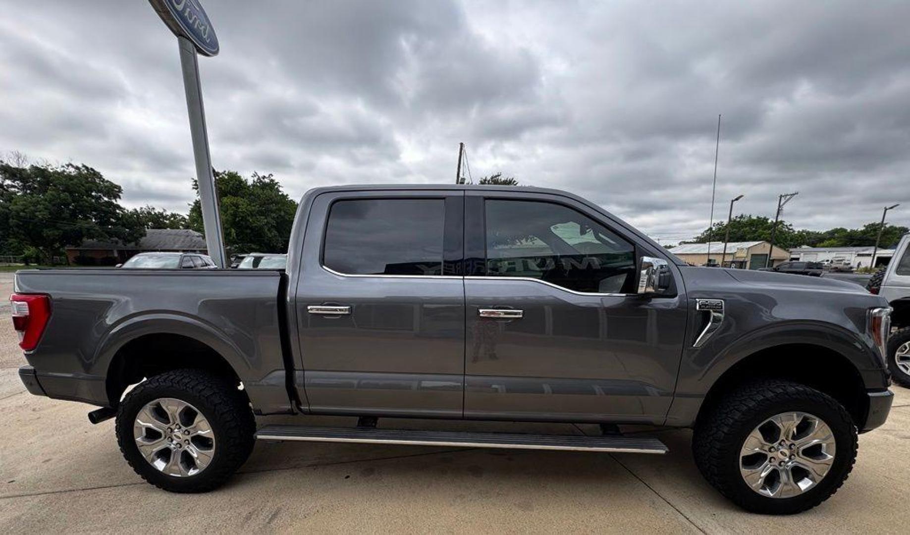 2021 Gray Metallic /Black Ford F-150 Platinum (1FTFW1E83MF) with an 3.5L V6 EcoBoost engine, Automatic transmission, located at 1105 E Mulberry, Kaufman, TX, 75142, (972) 962-2151, 32.589550, -96.300926 - Gray Metallic 2021 Ford F-150 4D SuperCrew Platinum 4WD 10-Speed Automatic 3.5L V6 EcoBoost 4WD.<br><br><br>Recent Arrival! Odometer is 5572 miles below market average!<br><br>Awards:<br> * NACTOY 2021 North American Truck of the Year<br>Please call Paul Murrey Ford Inc. In Kaufman Texas A Family D - Photo#12